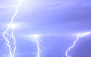 File - Lightning over the outskirts of Oradea, Romania, during the August 17, 2005 thunderstorm which went on to cause major flash floods over southern Romania.