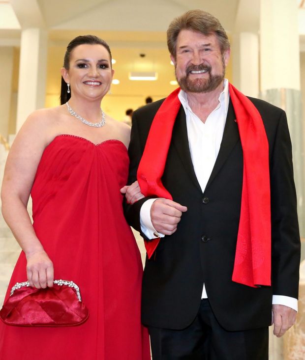 Senator Jacqui Lambie, with her "Kardashian hair" and Senator Derryn Hinch arrive for the Midwinter Ball.