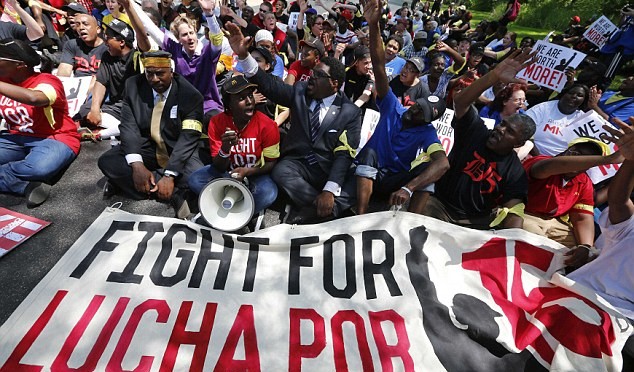 Workers stage a sitdown outside McDonalds HQ in protest