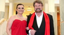 Senator Jacqui Lambie, with her "Kardashian hair" and Senator Derryn Hinch arrive for the Midwinter Ball.