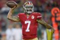 Protest: San Francisco 49ers quarterback Colin Kaepernick did not stand for the US national anthem.