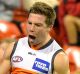 GOLD COAST, AUSTRALIA - AUGUST 06: Toby Greene of the Giants celebrates kicking a goal during the round 20 AFL match ...