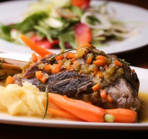 Euro comfort food: Lamb shank with baby carrots.