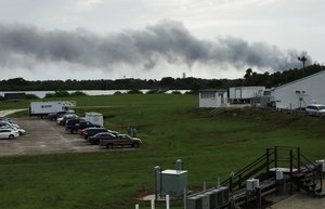 Smoke rises from a SpaceX launch site Thursday, Sept. 1, 2016, at Cape Canaveral, Fla. NASA said SpaceX was conducting a test firing of its unmanned rocket when a blast occurred.