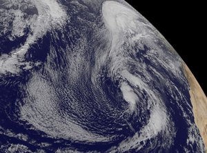 This visible image of the low pressure area in the Central North Atlantic Ocean, which developed into Hurrican Alex, was taken from NOAA's GOES-East satellite on Jan. 12 at 1445 UTC (9:45 a.m.) EST. Africa is seen to the right.