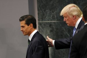 Republican presidential nominee Donald Trump walks with Mexico President Enrique Pena Nieto at the end of their joint statement at Los Pinos, the presidential official residence, in Mexico City, Wednesday, Aug. 31, 2016.