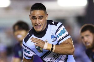 Showdown for the top spot: Valentine Holmes breaks the Storm defence earlier this season.