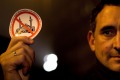 A demonstrator holds a sticker with a crossed mosque symbol during a march against "Islamification" in Berlin.