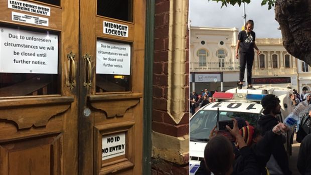 A notice on the outside of the closed Exchange Hotel on Tuesday night...and the violent scenes on Hannan Street during ...