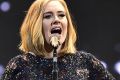 Adele says she was asked to perform at the Super Bowl.