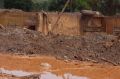 The dam burst caused a wave of mud to bury the district of Bento Rodrigues and clog the Rio Doce river in Minas Gerais state.