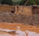 The dam burst caused a wave of mud to bury the district of Bento Rodrigues and clog the Rio Doce river in Minas Gerais state.