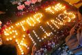 Human rights activists light candles in Quezon City for the victims of extra-judicial killings.