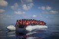 A boat carrying around 150 migrants from sub-Saharan Africa wait to be rescued north of Libya last week.