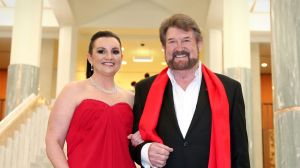 Senator Jacqui Lambie, with her "Kardashian hair" and Senator Derryn Hinch arrive for the Midwinter Ball.