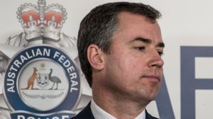 Justice Minister Michael Keenan fields questions at a press conference in Melbourne.