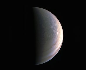 NASA's Juno spacecraft captured this view as it closed in on Jupiter's north pole, about two hours before closest approach on Aug. 27, 2016. The images show storm systems and weather activity unlike anything previously seen on any of our solar system’s gas-giant planets.