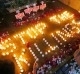 Human rights activists light candles in Quezon City for the victims of extra-judicial killings.