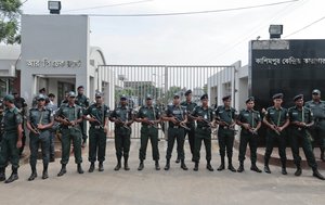 Bangladeshi security personnel stand guard in front of Kashimpur Central Jail, where Mir Quashem Ali, a senior leader of the main Islamist party Jamaat-e-Islami, is being held, in Gazipur, on the outskirts of Dhaka, Bangladesh, Saturday, Sept. 3, 2016.