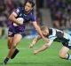 See ya!: Will Chambers evades the tackle of the Sharks' Luke Lewis on Saturday night as the Storm clinched the minor ...