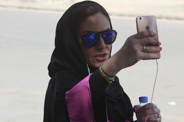 Saudi activist Ghada Ghazzawi tapes a selfie video marking a historical day for Saudi women as she arrives to vote for ...