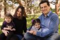 "It takes a whole village to have me work," says Sydney's Betina Naiman with husband Clarence and two daughters Libby, ...