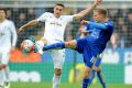 Leicester's Marc Albrighton (right) and Swansea's Angel Rangel battle for the ball at the King Power Stadium on Sunday.