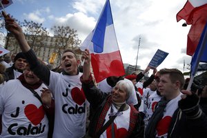 Residents of Calais gather in front of the Economy ministry during a protest, in Paris, Monday, March 7, 2016. Hundreds of Calais residents are heading to Paris to protest against the negative impact of the migrant crisis on the local economy.