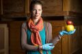 PhD candidate Johanna Christensen with two of the 643 wax apple models in Museum Victoria's wax fruit and vegetable ...