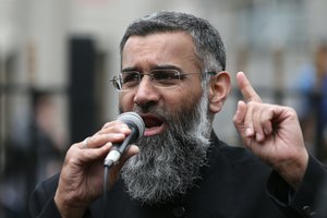 File - Anjem Choudary, right, a British Muslim social and political activist and spokesman for Islamist group, Islam4UK, speaks following prayers at the Central London Mosque in Regent's Park, London, Friday, April 3, 2015.