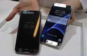 Samsung Galaxy S7, left, and S7 Edge are displayed during the Samsung Galaxy Unpacked 2016 event on the eve of this week’s Mobile World Congress wireless show, in Barcelona, Spain, Sunday, Feb. 21, 2016.