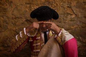 Spanish bullfighter Jose Tomas touches his eyebrows before the paseillo or ritual entrance to the arena before a ...