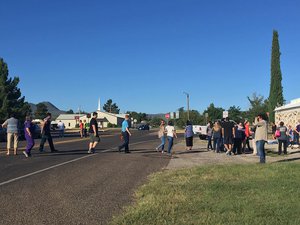 Students evacuate from Alpine High School in Brewster County, Texas, following a shooting incident. Local police say a female pupil shot another student before fatally turning her gun on herself.