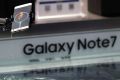 A man tries out the Samsung's latest smartphone Galaxy Note 7 at a roadshow booth outside a shopping mall in Beijing, ...