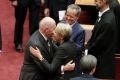 Governor-General Sir Peter Cosgrove embraces Deputy Opposition Leader Tanya Plibersek after the opening of the 45th ...