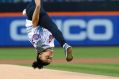 United States Olympic Gymnastics gold medalist Laurie Hernandez does a flip as she throws out the first pitch before a ...