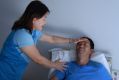 In-Young Joyce helps her husband Myung Jin Juong at their home in Epping. 