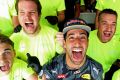 Daniel Ricciardo of Australia and his Red Bull Racing team celebrate after finishing second after the Belgium grand prix.