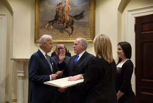 File - Vice President Joe Biden swears in CIA Director John Brennan in the Roosevelt Room of the White House, March 8, 2013.