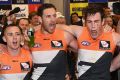 Tom Scully, Shane Mumford and Jeremy Cameron sing the song with gusto.