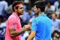 NEW YORK, NY - SEPTEMBER 06: Novak Djokovic (R) of Serbia shakes hands with Jo-Wilfried Tsonga of France after defeating ...