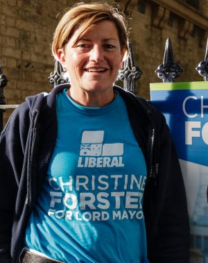 Liberal candidate Christine Forster hands out how-to-vote cards in Surry Hills.