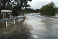 Portland-Casterton Road, Sandford, is flooded.