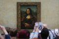 The narrator's feeling of alienation is exemplified in a visit to the Louvre, jostling to glimpse the Mona Lisa over the ...