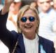 Democratic presidential candidate Hillary Clinton waves after leaving her daughter's apartment on Sunday.