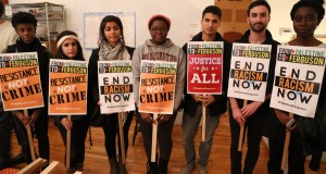 Members of the Palestine Contingent to Ferguson October pose with signs for the weekend's events. Photos of a Palestine2Ferguson sign at the main march during Ferguson October. (Photo by Christopher Hazou)