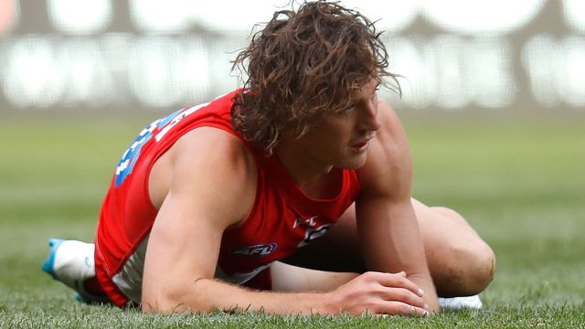 Down for the count: Kurt Tippett on the turf against GWS.