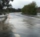 Portland-Casterton Road, Sandford, is flooded.