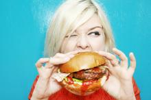 woman eating hamburger