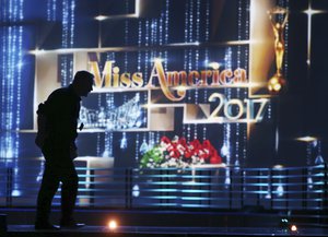 A worker walks across the stage during preparations for the Miss America 2017 pageant, Sunday, Sept. 11, 2016, in Atlantic City, N.J.